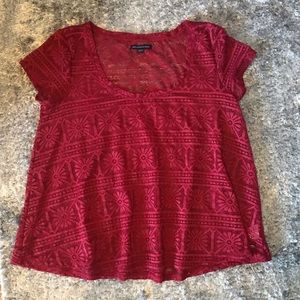 Red American Eagle cut-out shirt.